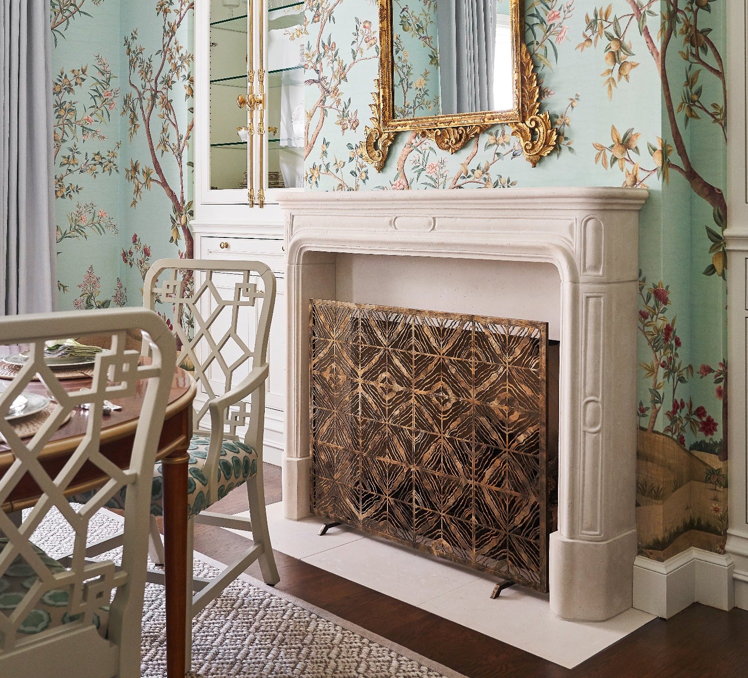 Tapestry Fireplace Screen with floral wallpaper and area rug at the front